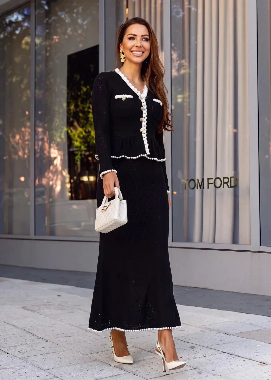 Long sleeve knit dress with peplum waist seam and pearl-trimmed flap pockets
