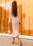 Luxury ribbed knit midi dress styled for daytime event