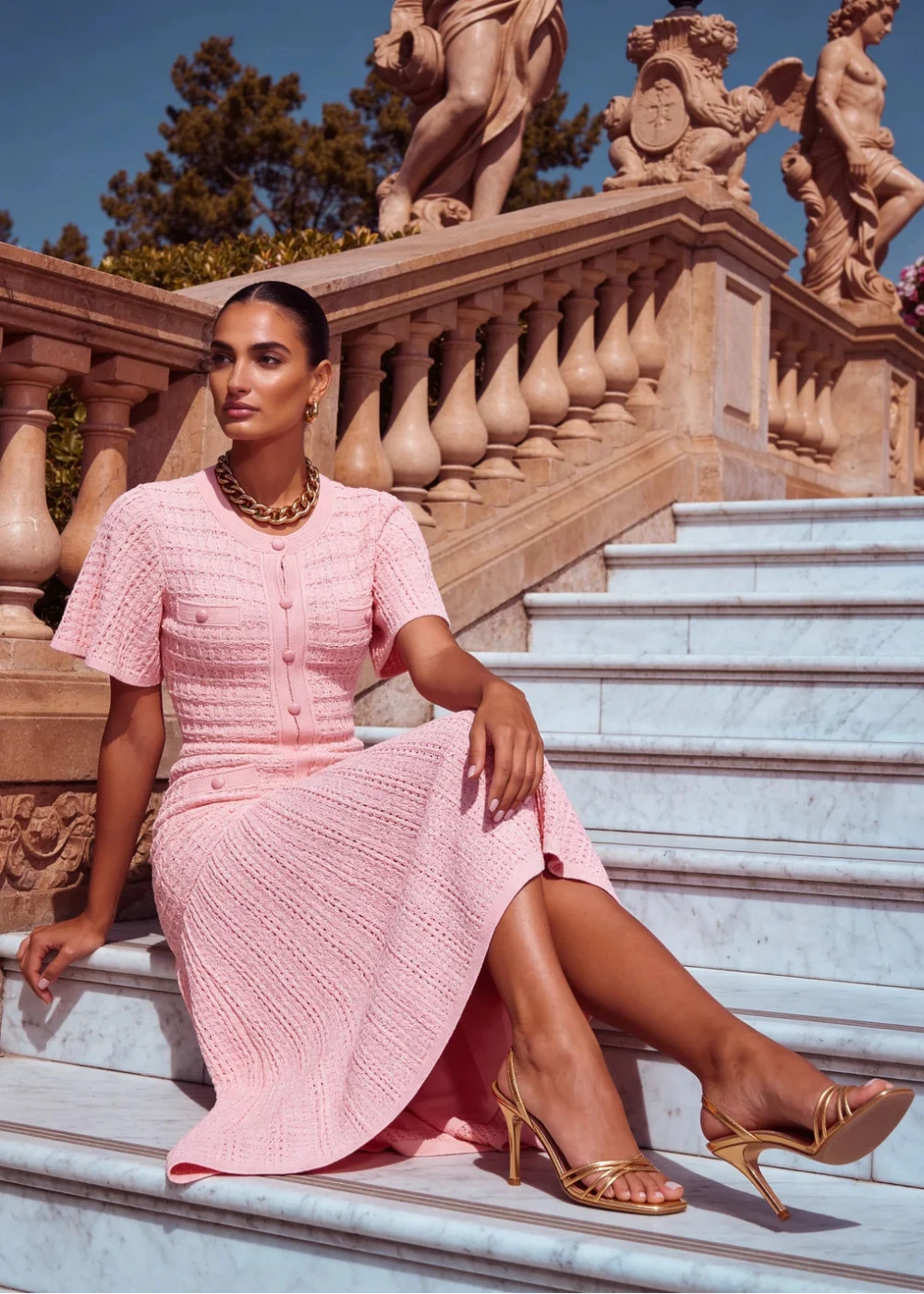 Pink knit midi dress with flutter sleeves
