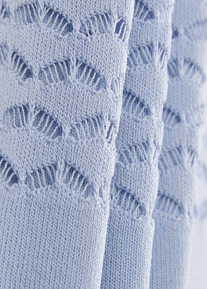 Close-up of elegant powder blue knit mermaid dress neckline and pointelle detailing
