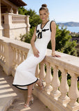 Quiet luxury dress featuring premium knit craftsmanship in an ivory and black palette.