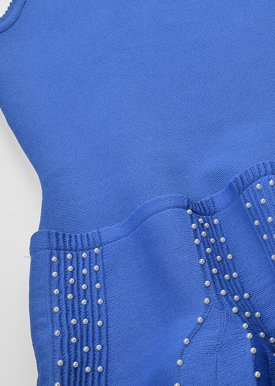 flounce skirt detail on royal blue studded knit dress