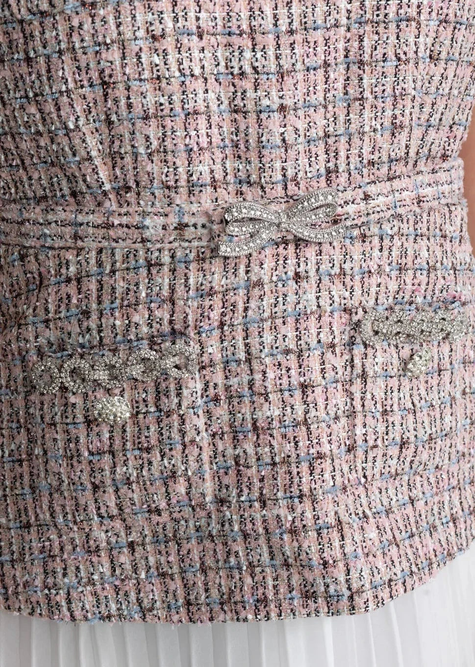 close up view sleeveless tweed midi dress with pleated skirt