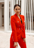 Professional red suit set featuring a tailored blazer with gold-tone buttons and matching pants, styled for modern elegance.