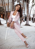 Elegant pink double breasted blazer paired with matching tailored pants