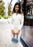 Side view of elegant white midi dress with asymmetric neckline and exposed shoulder