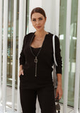 Minimalist and sophisticated, this soft black knitted set brings effortless elegance to your wardrobe