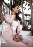 Pink two-piece blazer and pants suit designed for formal occasions