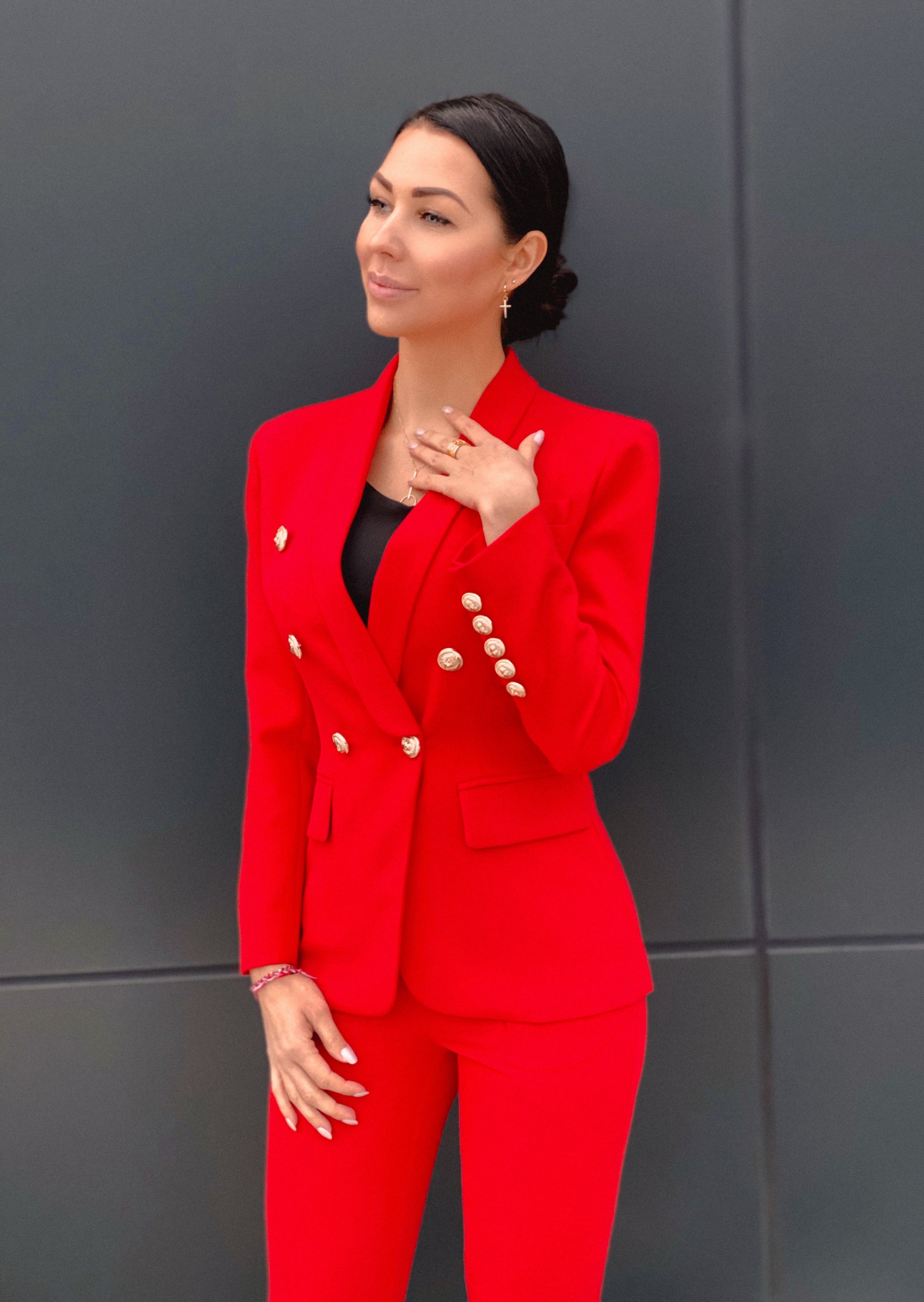 Luxury meets power – red double-breasted blazer and trousers set."
