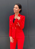 Luxury meets power – red double-breasted blazer and trousers set."